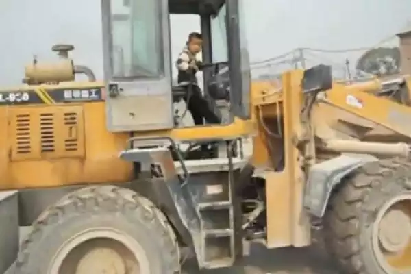 Watch A 5-Year-Old Chinese Boy Drive A Front Loader Tractor Like A Pro